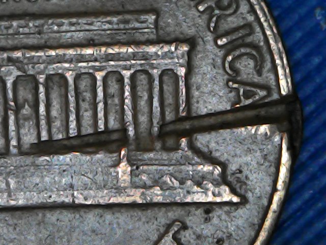 1963-Penny-Struck-Through-Object?