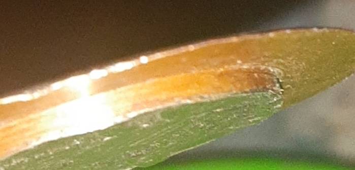 1984-Kenneddy-Half-Dollar-Is-Missing-The-Outer-Rim-Of-The-Reverse-Side