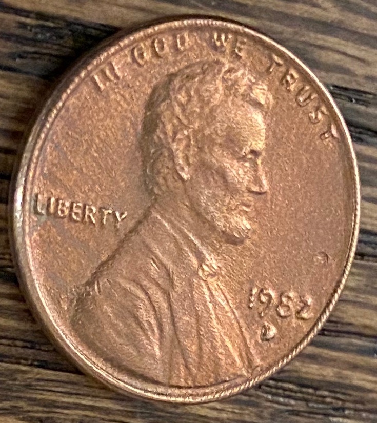 1982-Copper-Cent,-Strange-Texture-And-Filled-D-Mint-Mark