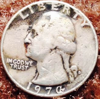 197?-Quarter:-Odd-Character-Possible-Mint-Error?