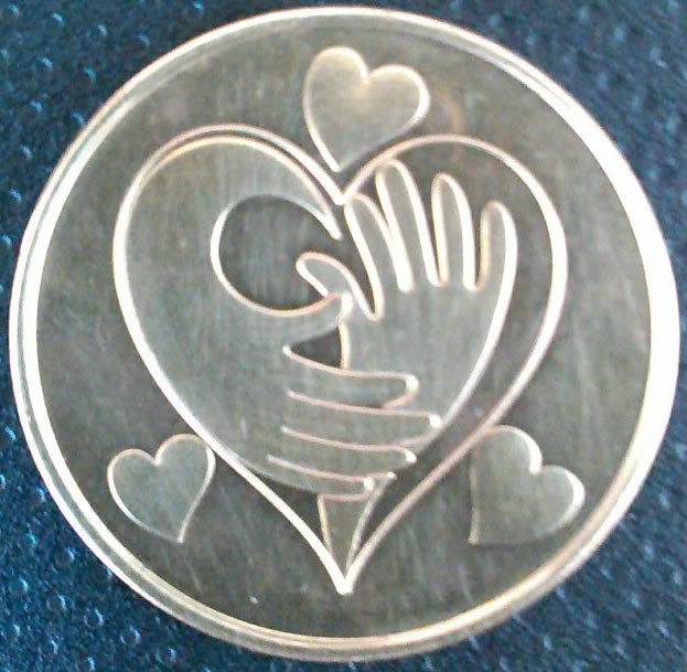 Found-Round-Gold-Color-Coin-With-Hearts-And-Hands