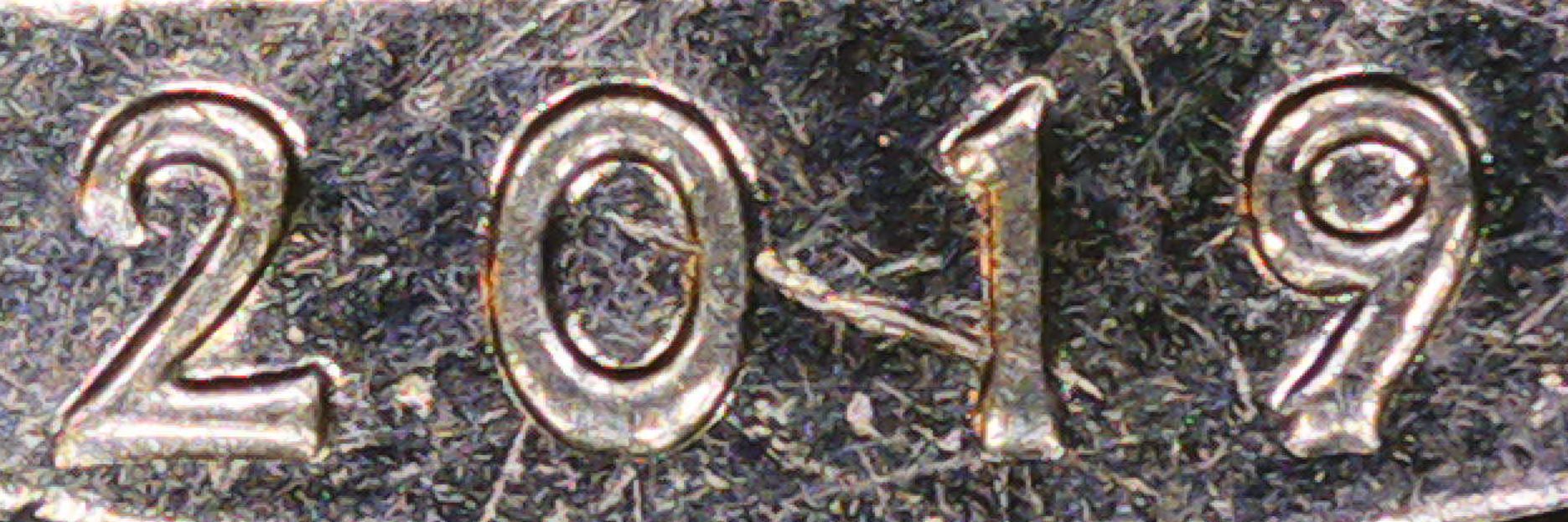 Is-This-A-Die-Chip-That's-Near-The-0-And-1-Of-This-2019-Lowell-Quarter?