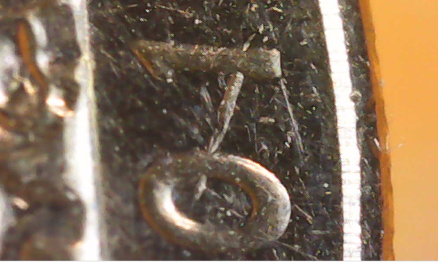 Is-This-A-Die-Chip-That's-Near-The-0-And-1-Of-This-2019-Lowell-Quarter?
