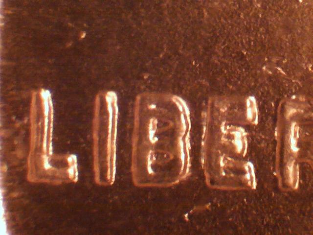 1955-Cent-In-Case-MS-67-Red