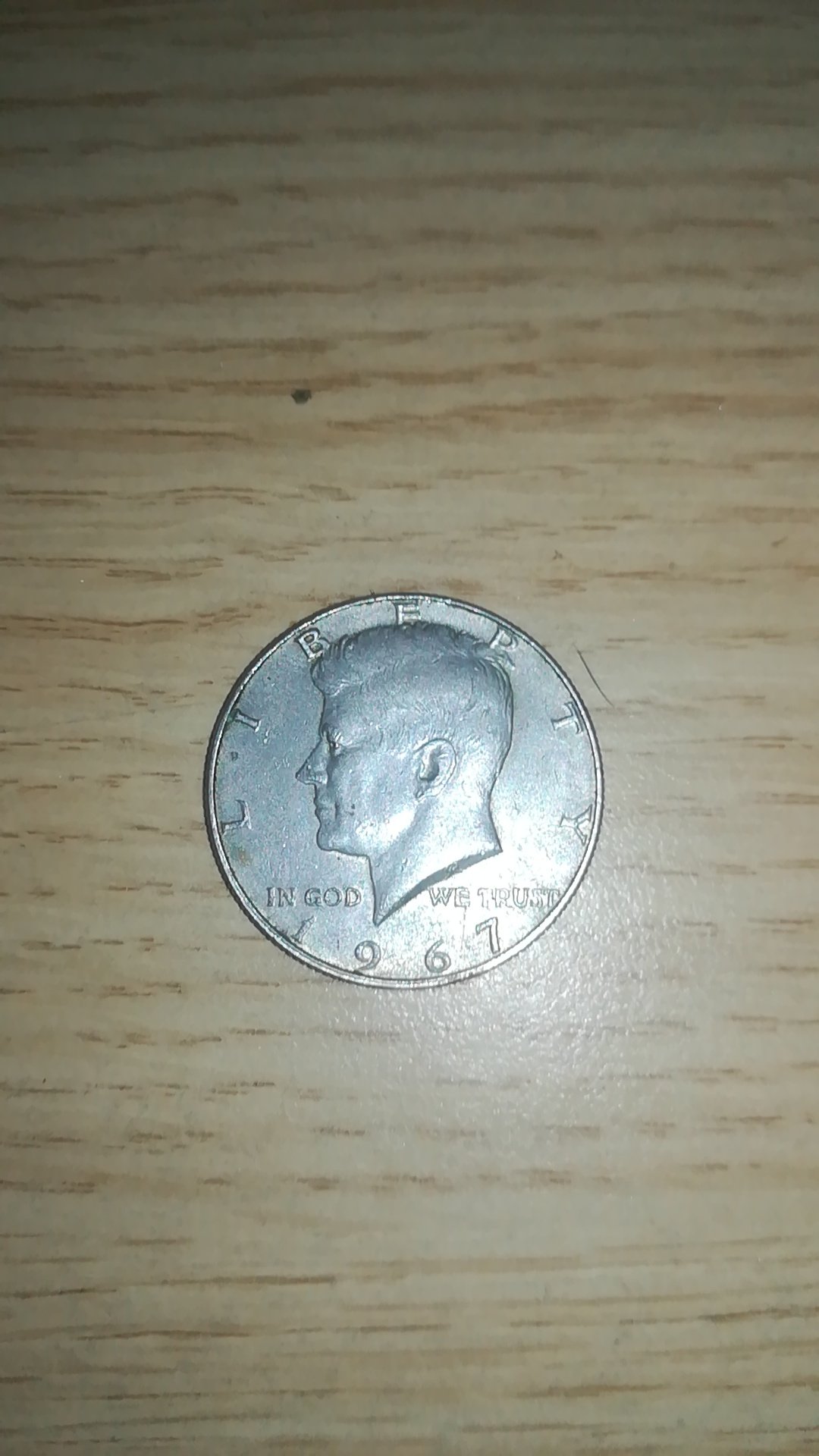 Brit-With-A-Kennedy-Half-Dollar-Seeking-Info