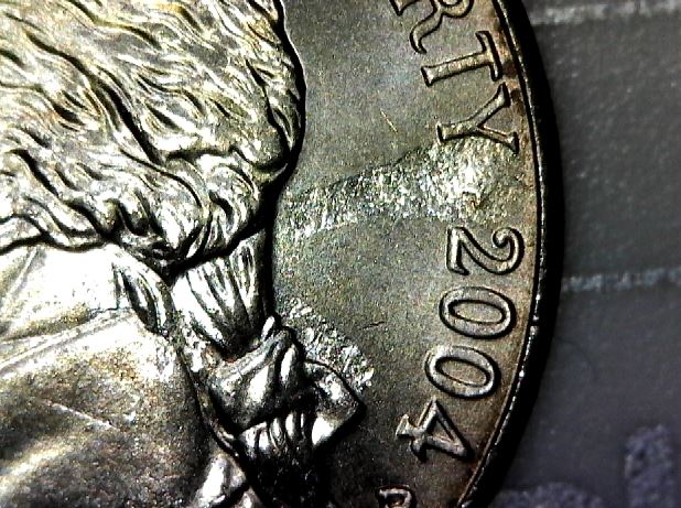 Struck-Through-Roll-Of-Nickels