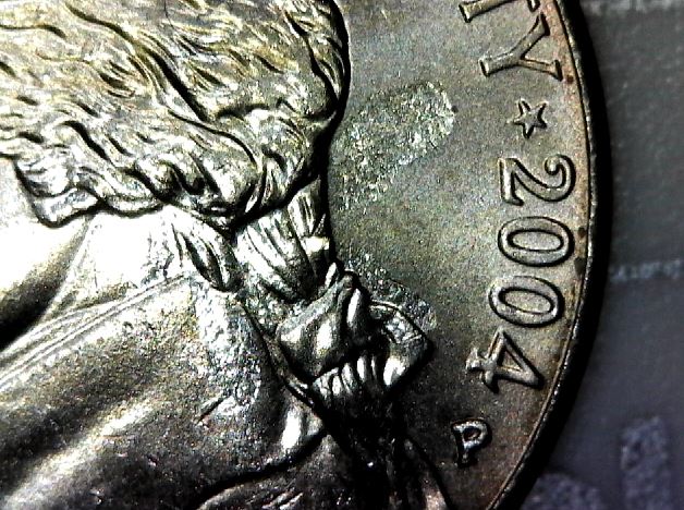 Struck-Through-Roll-Of-Nickels