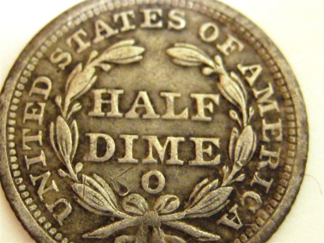 Half-Dime-And-Coins-Found-With-It
