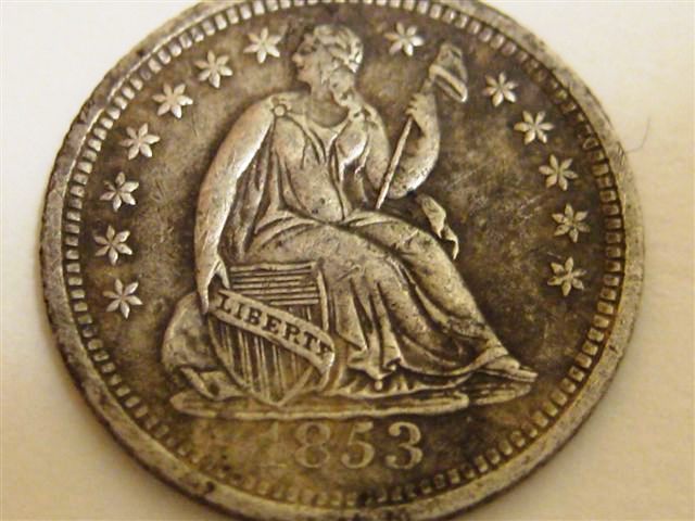 Half-Dime-And-Coins-Found-With-It