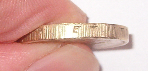 Fake-£1