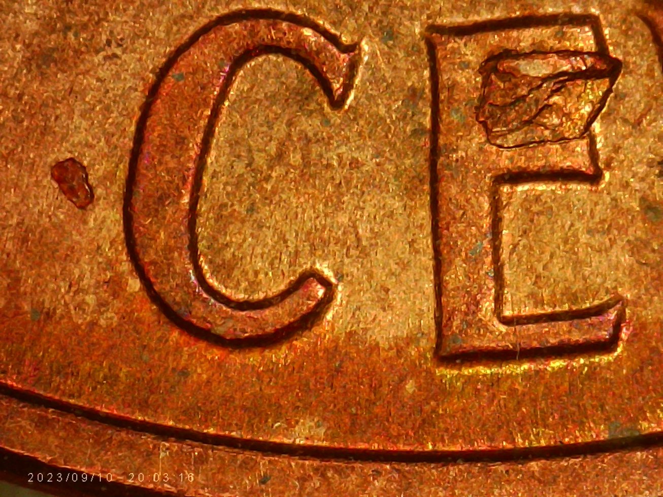 1959-D-LMC.-Is-This-Die-Chip?-Or-From-Another-Coin?-Looks-Like-There-Is-Letters--On-It.-Thanks-Bent.