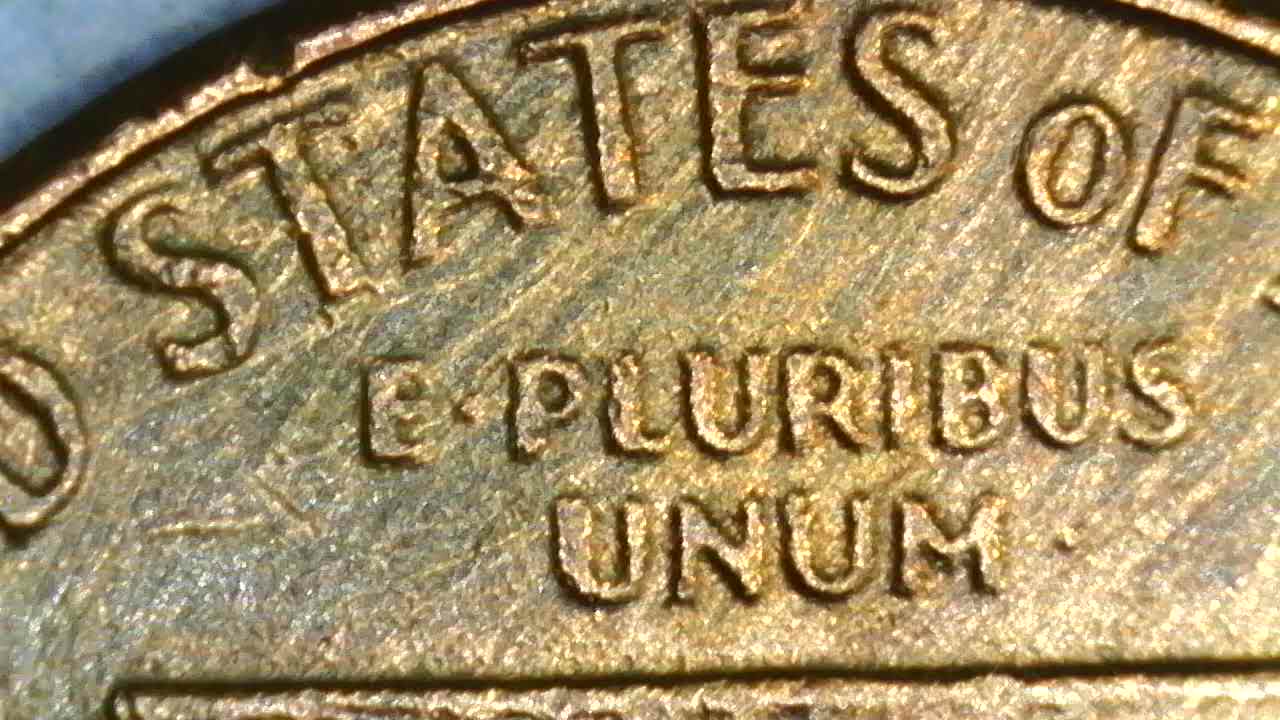 1976-D-Cent-What-Have-I-Found?--Bleb,-Occluded-Gas-Bubbles,-Flow-Lines,-Parallel-Lines?