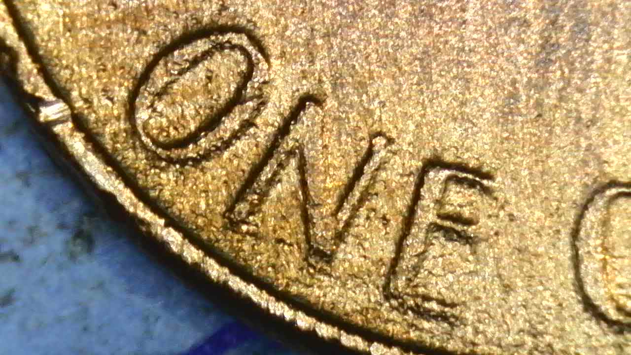 1976-D-Cent-What-Have-I-Found?--Bleb,-Occluded-Gas-Bubbles,-Flow-Lines,-Parallel-Lines?