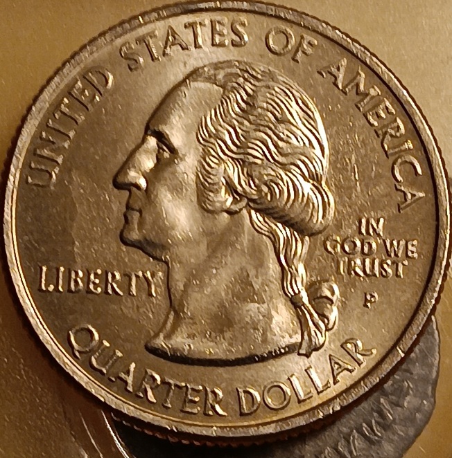 2005-Kansas-And-Wyoming-State-Quarters-Struck-Through-Grease-Error