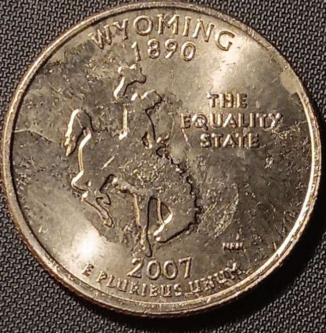 2005-Kansas-And-Wyoming-State-Quarters-Struck-Through-Grease-Error