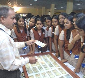 Click to See if There's a Larger Image! Students-In-India-Learn-To-Identify-Counterfeits.