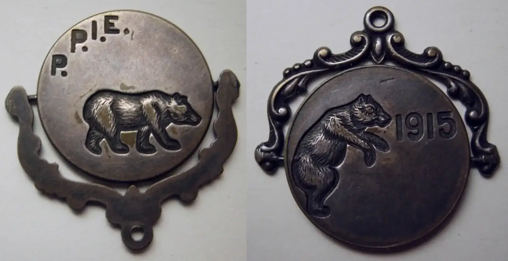 1915-Panama-Pacific-Exposition-Brass-Bear-Ppie-Spinner-With-A-Curved-Clip