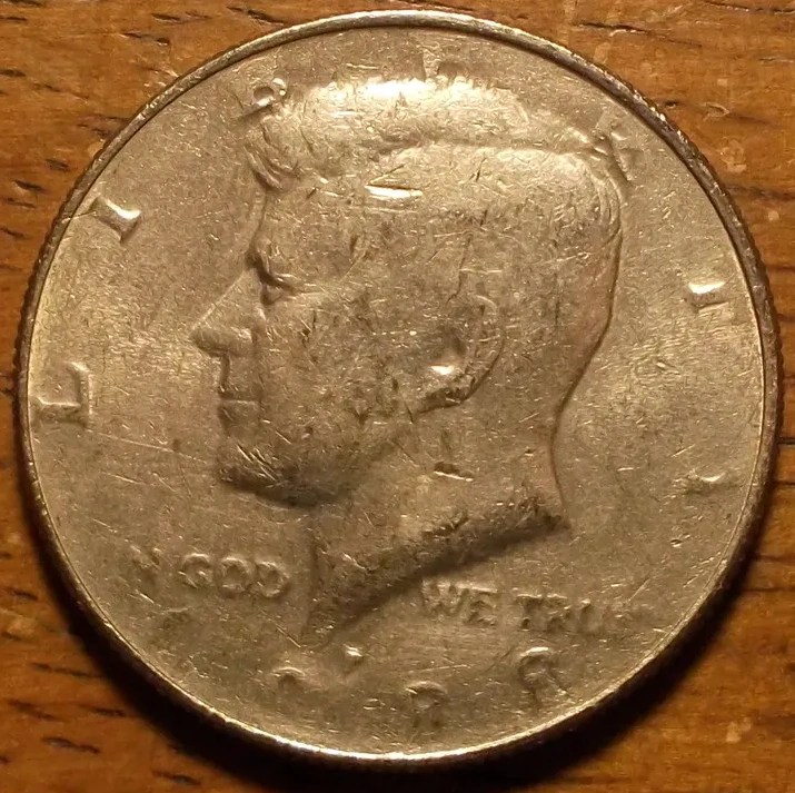 Kennedy-Half-Dollar:--Struck-Through-Obverse-&-Reverse?
