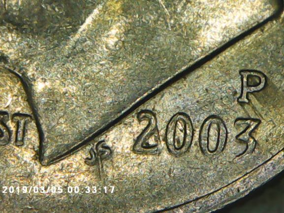 What-Is-This-Called-When-It-Looks-Like-Ink-Streaks?-2003-P-Dime