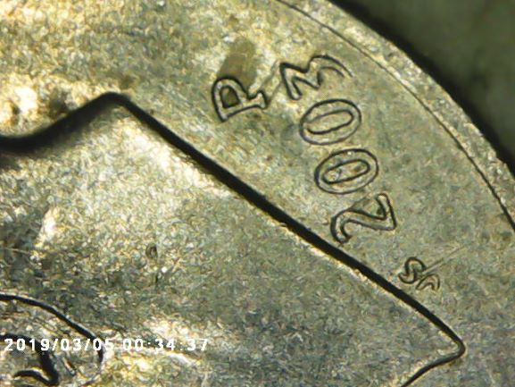 What-Is-This-Called-When-It-Looks-Like-Ink-Streaks?-2003-P-Dime