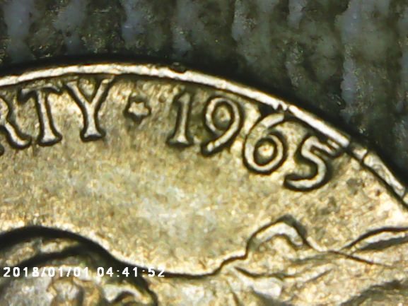 1965-Nickel-With-A-T-And-Something-Inside-Of-God
