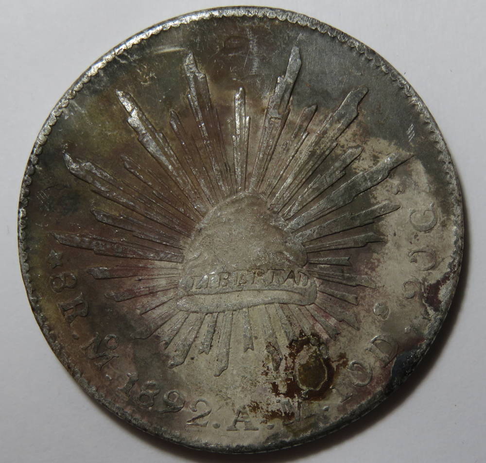 Common-1892-MO-Cap-And-Rays-8-Reales-W/Fire-Damage?