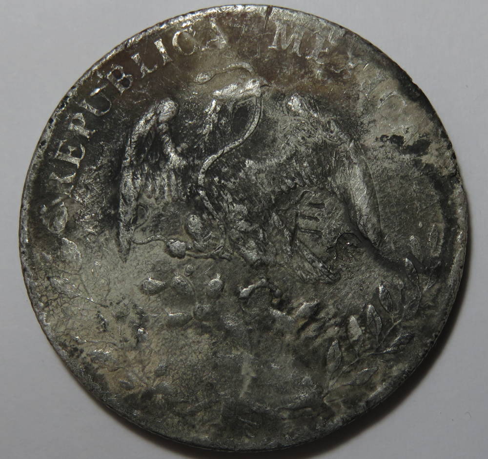 Common-1892-MO-Cap-And-Rays-8-Reales-W/Fire-Damage?