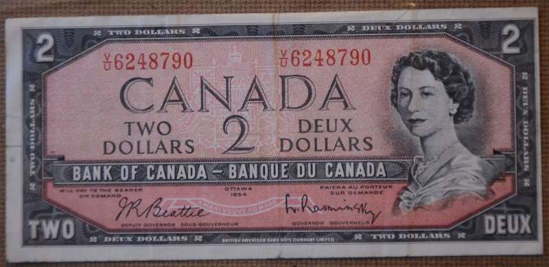 Unevenly-Cut-Or-Misaligned-Printing--$1-Bill-Question