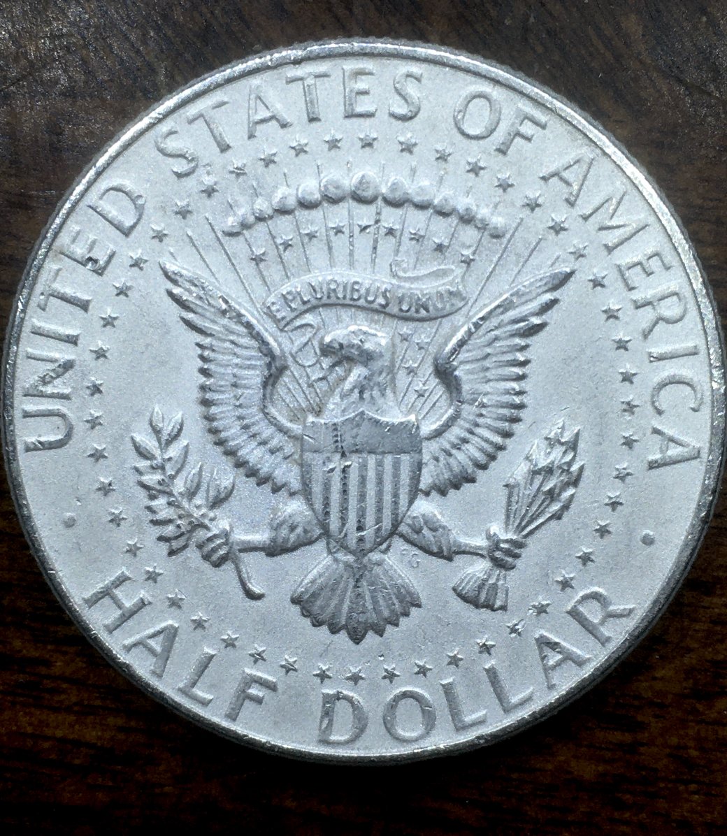What-Kind-Of-1964-Kennedy-Half-Dollar-Looks-Frosty-All-Over-Like-This?