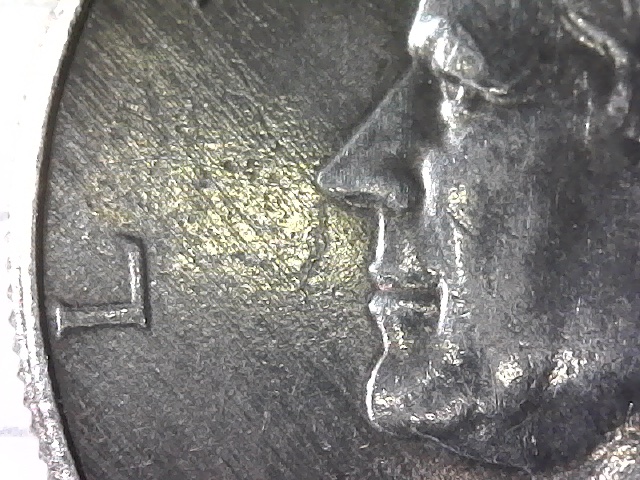 1964-Kennedy-Half-What-Is-Hanging-From-His-Nose?
