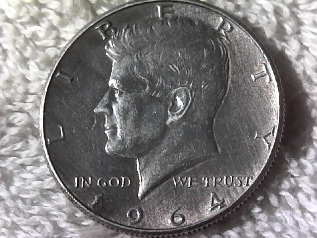 1964-Kennedy-Half-What-Is-Hanging-From-His-Nose?