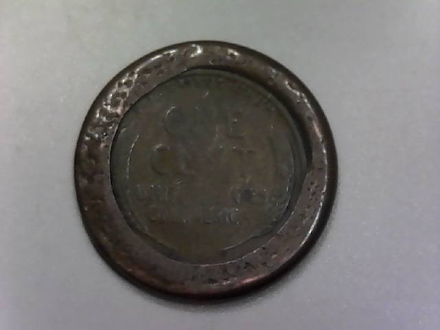 Three-Lincoln-Cents-Struck-Off-Center-And-One-?-Jewelry-Piece?