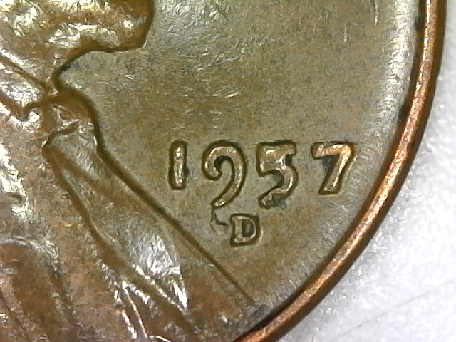 1957-D-What-Is-The-Raised-Chunk-Next-To-The-Mint-Mark?