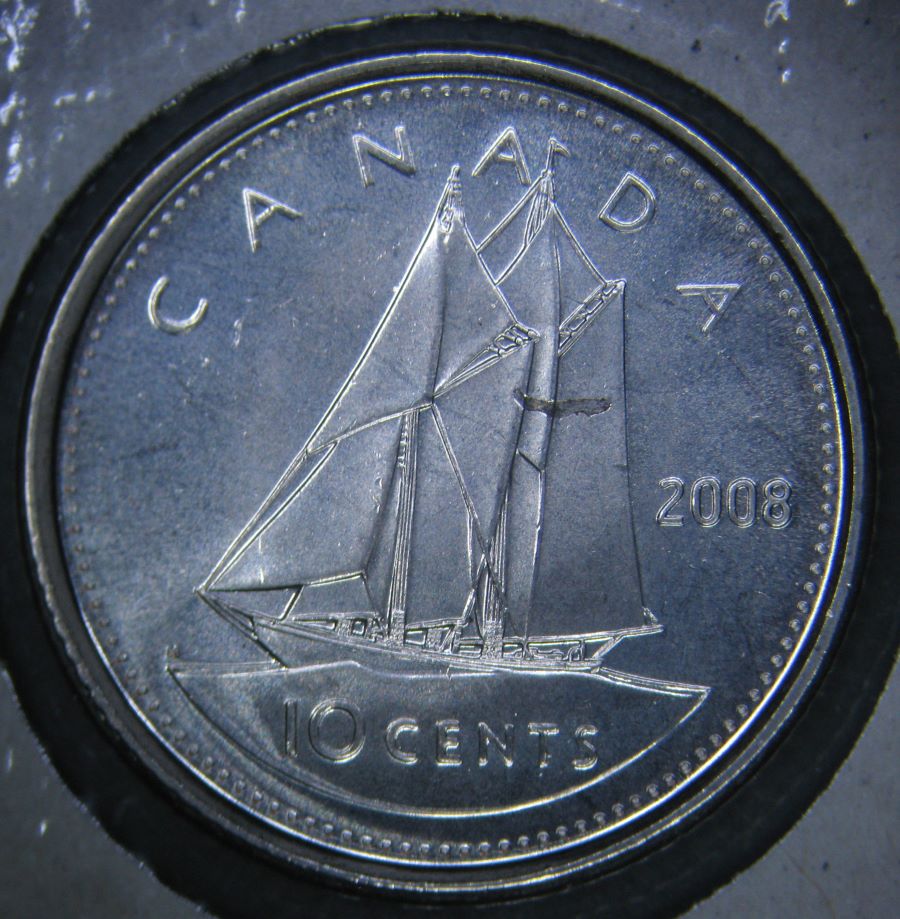 2008---10-Cent-Struck-Over-Metal-Fragment-And-Imbedded.
