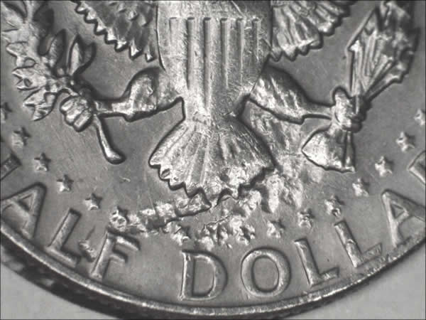 1982-P-Kennedy,-Damage?-Planchet-Flaw?-Or-Struck-Thru?