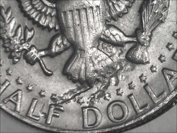 1982-P-Kennedy,-Damage?-Planchet-Flaw?-Or-Struck-Thru?