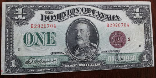 1923-Bronze-Seal-One-Dollar---Grade-And-Value-Please
