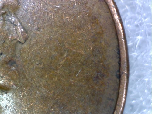 1944-Wheat-Penny,-Line-Across-Obverse.-Lamination-Error?