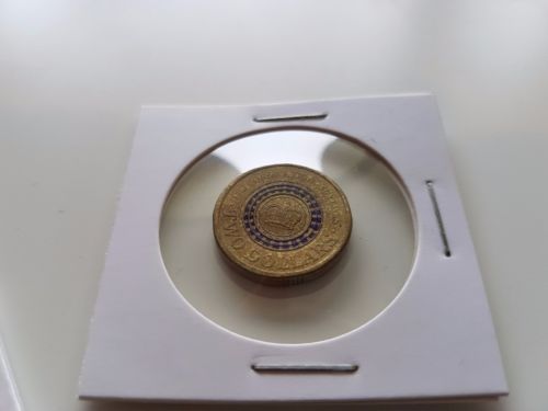 Queen's-Head-Replaced-On-This-2013-$2-Purple-Coronation-Coin?