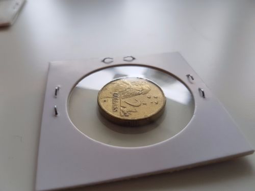 Queen's-Head-Replaced-On-This-2013-$2-Purple-Coronation-Coin?