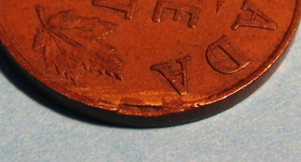 1933-George-1-Cent-Clipped-Error-?