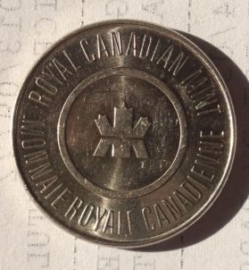 Maple-Twig-Design-On-Loonie-Sized-Coin