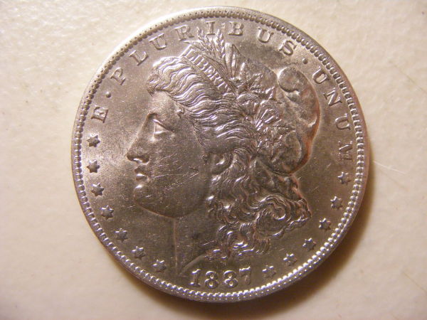 Raw-1887-O-Morgan-Dollar