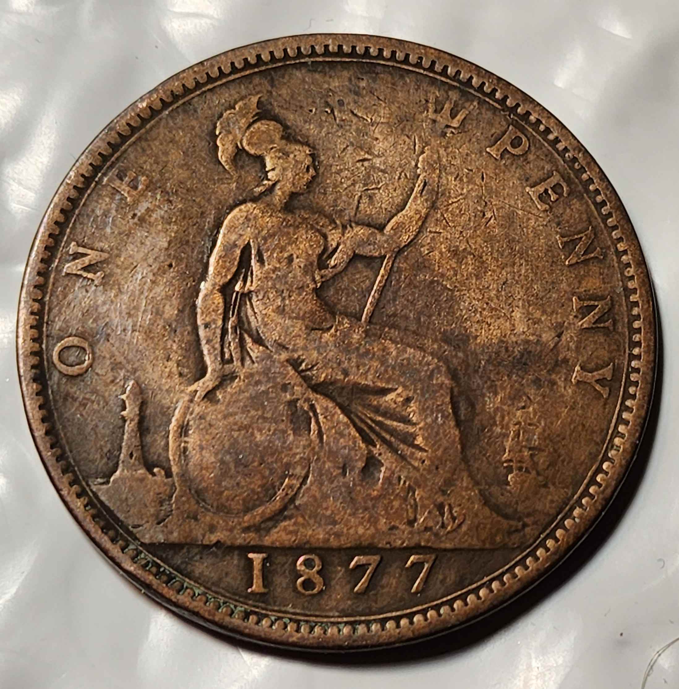 1877-British-Penny---What-Do-You-Think-Caused-This?--Post-Mint?