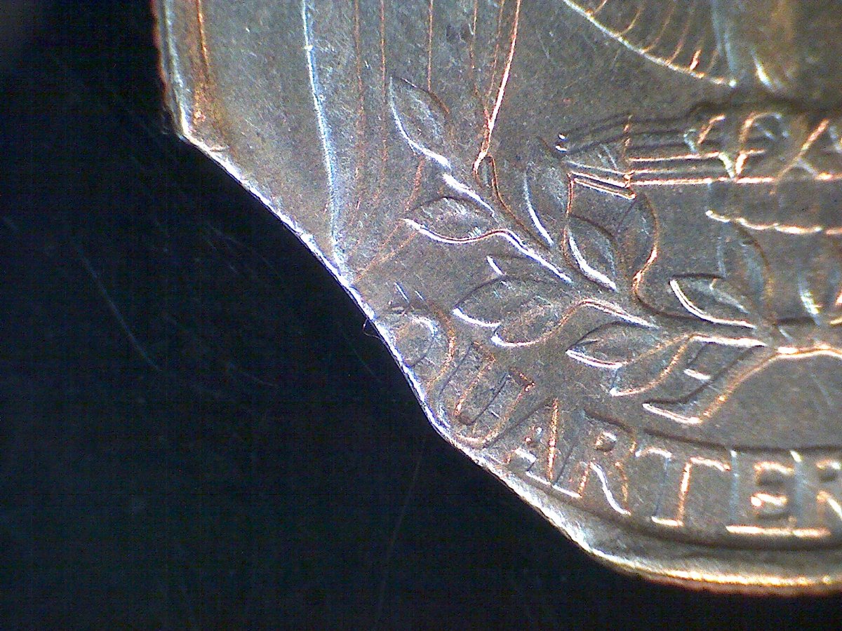 1996-Quarter,-Looks-Like-2-Curved-Clips-In-Same-Clip