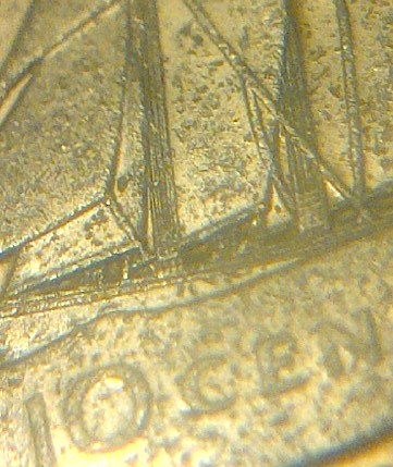 Any-Ideas-On-This--Canadian-10-Cents