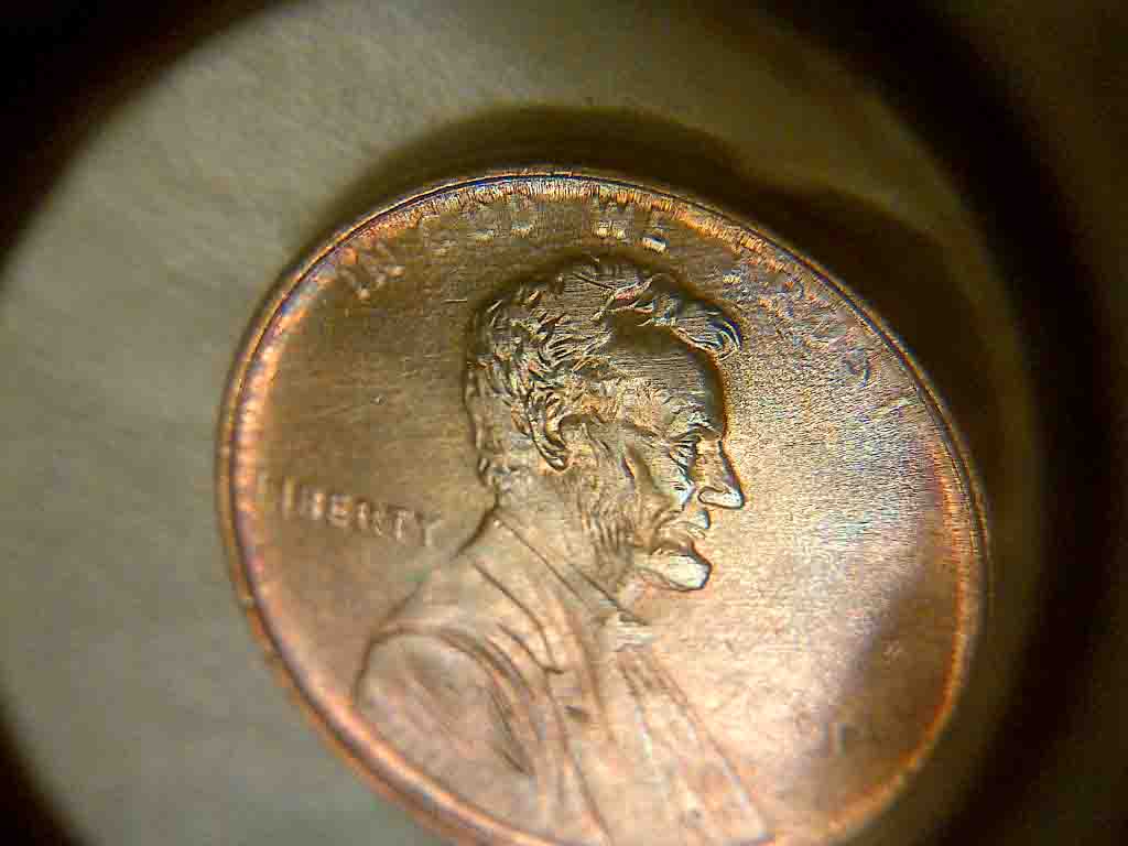 Here-Is-2-Diff-US-Cents-Struck-Through-Grease?