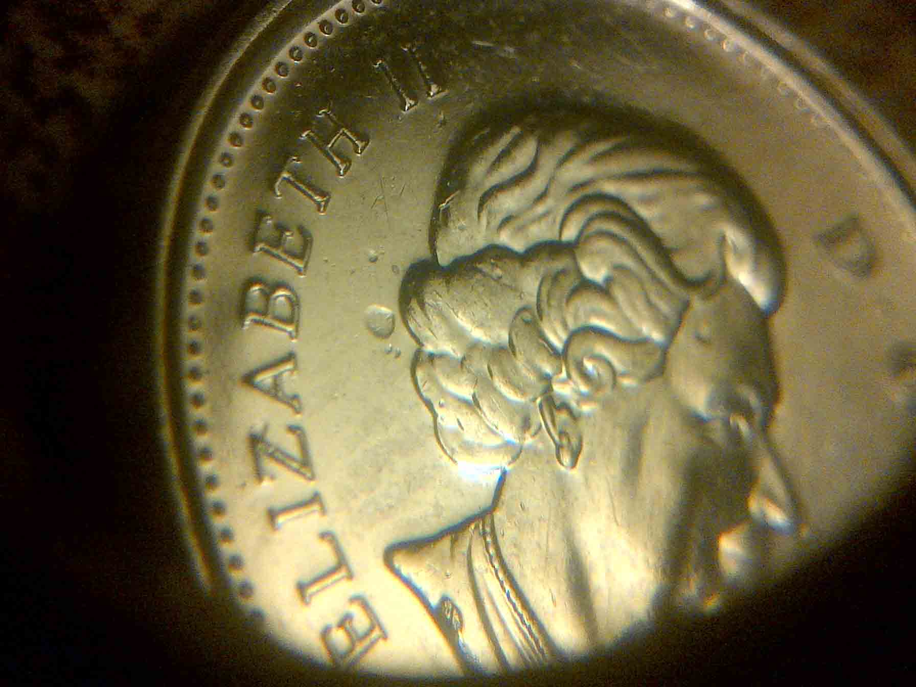 2012-5-Cents-Struck-Though-Debris