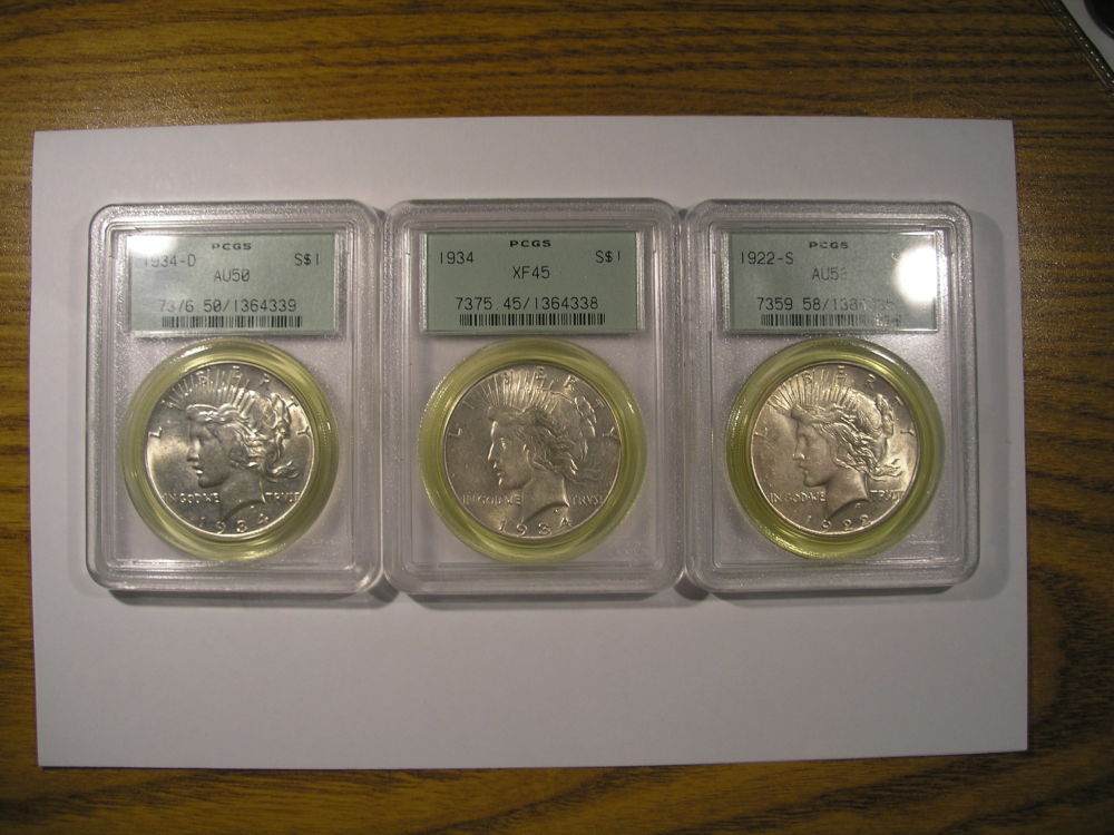 Green-Ring-Around-Peace-Dollar-In-In-Old-PCGS-Holder.