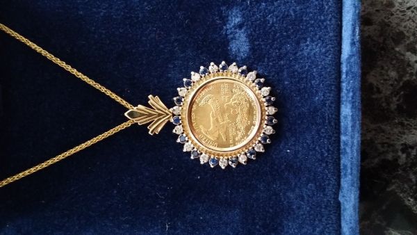 2005-1/10-Gold-Eagle-Necklace....help!